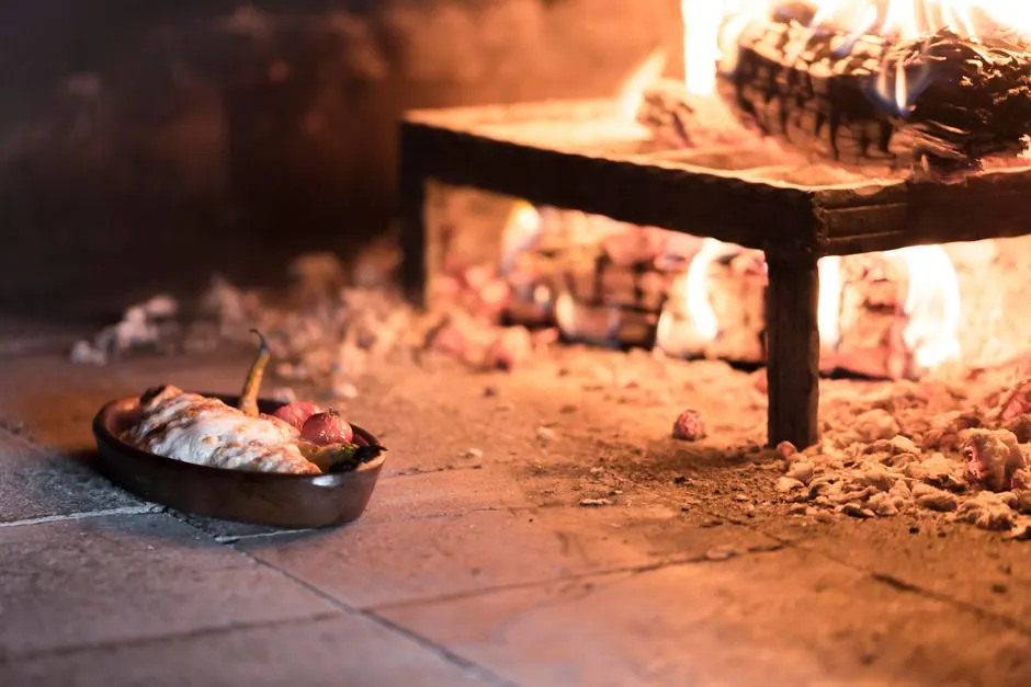 Delicious Turkish dish cooking in a traditional stone oven, showcasing authentic culinary heritage.